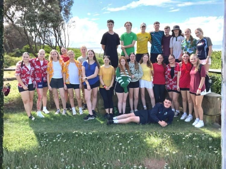 Students at cross country wearing their house colours