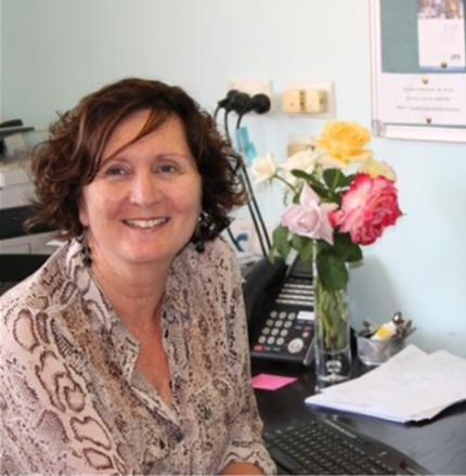 Principal sitting at her desk