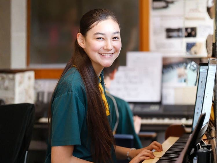 Student playing the piano