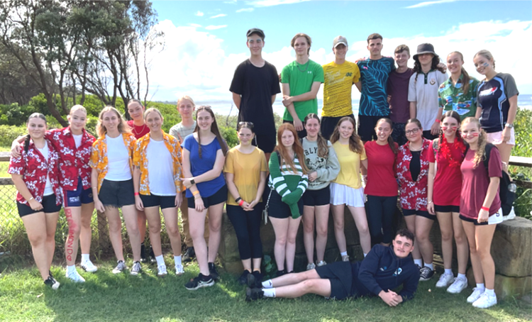 Students at cross country in house colours
