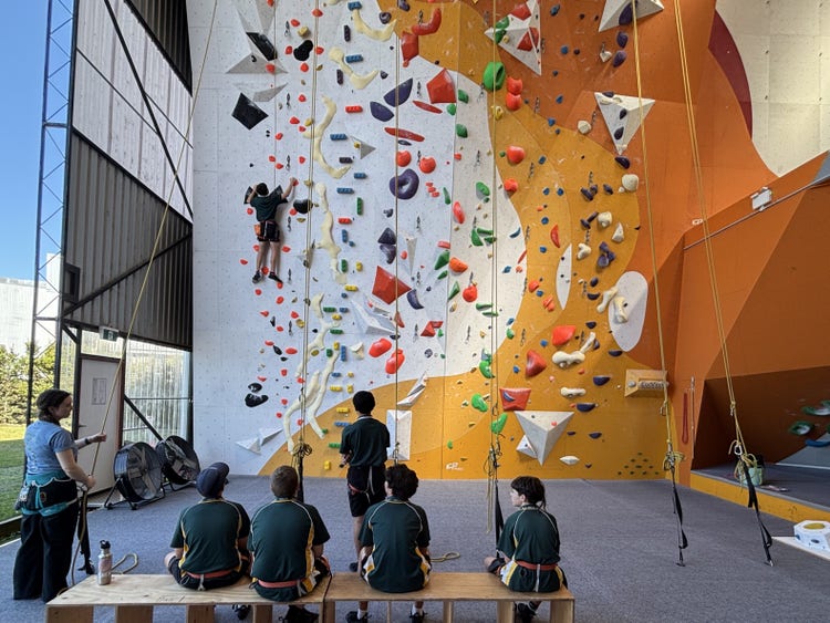 Students at indoor rock climbing